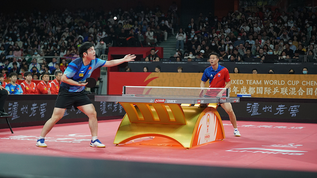Fan Zhendong (L) and Wang Yang in action during the ITTF Mixed Team World Cup second stage in Chengdu, southwest China's Sichuan Province, December 6, 2023. /CFP
