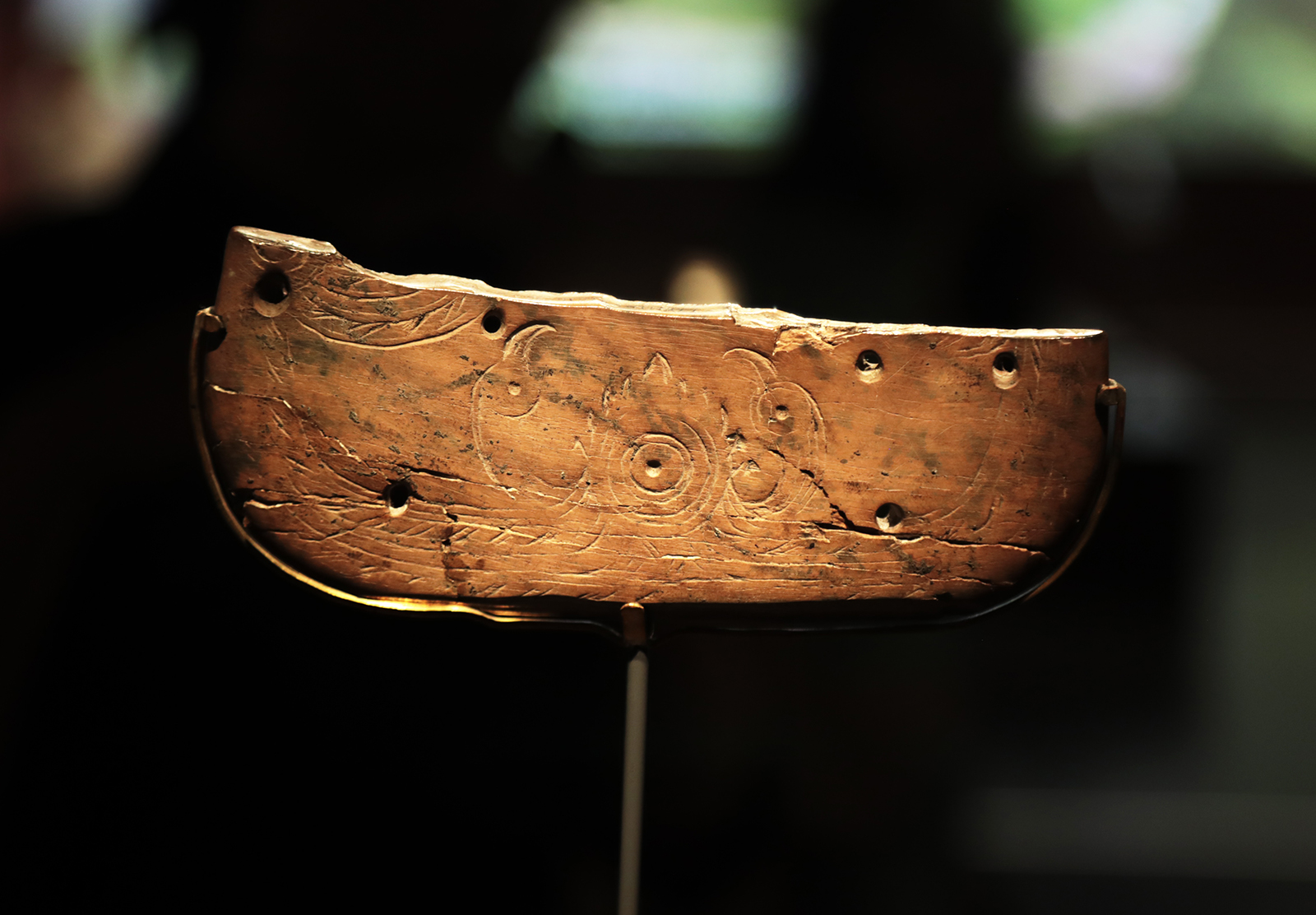 A dish-shaped ivory object adorned with two birds worshipping the sun dating to the Neolithic Age is on display in the Zhijiang Branch of the Zhejiang Provincial Museum in Hangzhou, Zhejiang Province. /CGTN