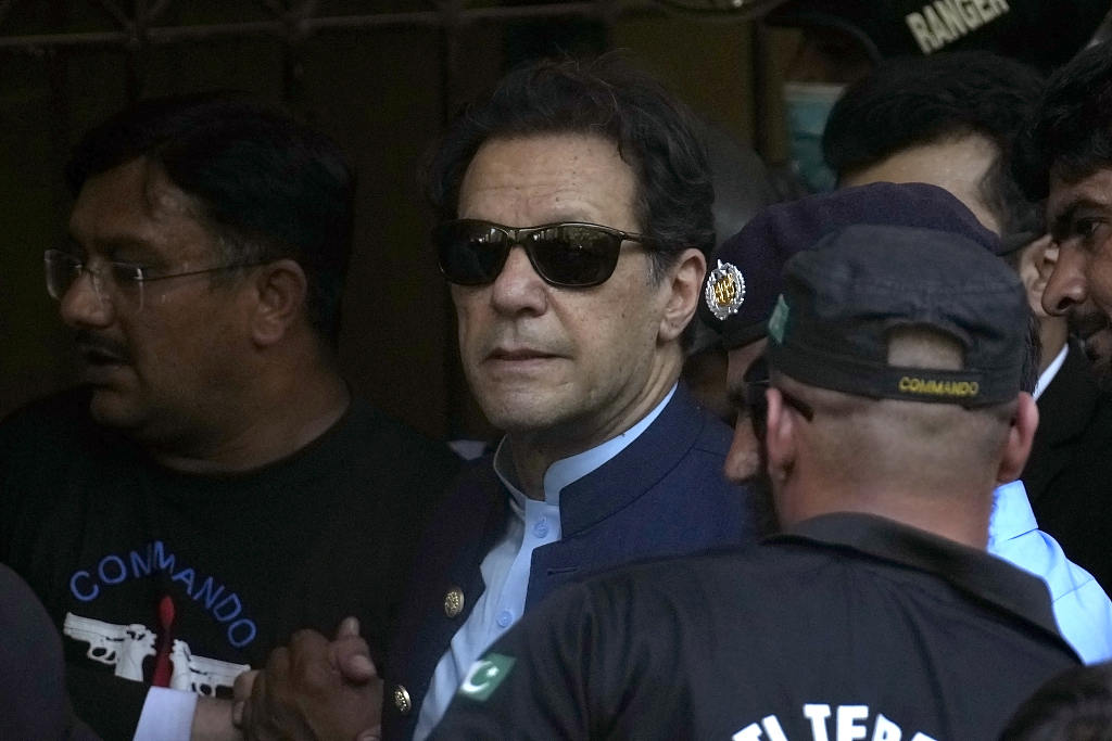 Pakistan's former Prime Minister Imran Khan is escorted by security as he arrives to appear in court in Islamabad, Pakistan, May 12, 2023. /CFP