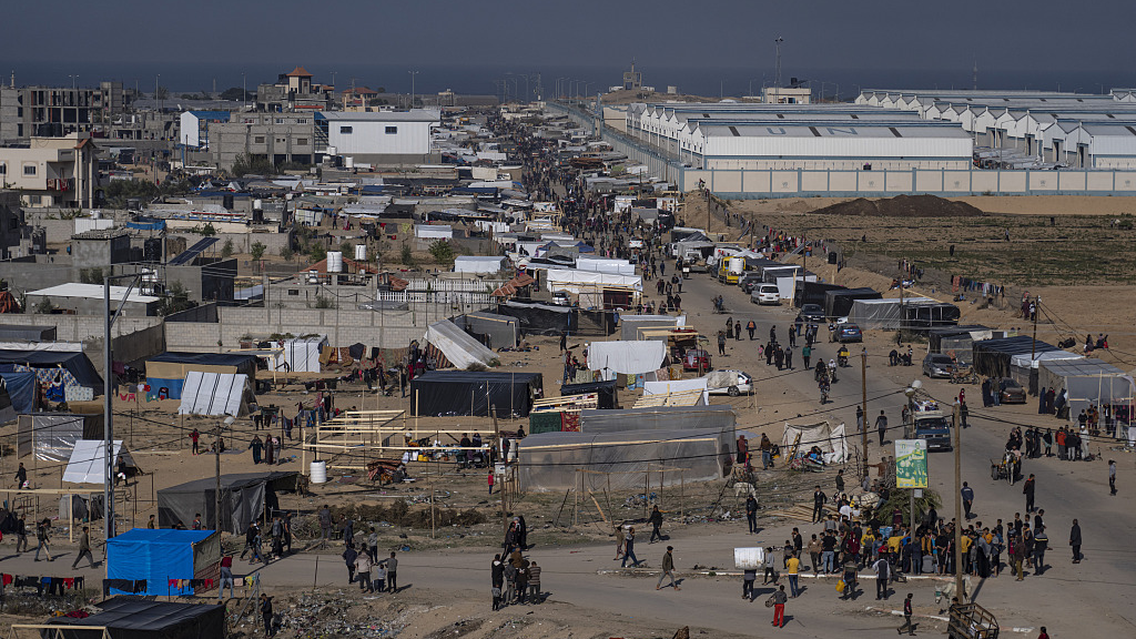 Palestinians displaced by the Israeli bombardment of the Gaza Strip gather at a tent camp, in Rafah, southern Gaza strip, December 4, 2023. /CFP