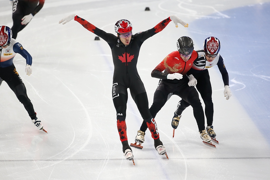 Dandjinou William (C) of Canada crosses the line first, followed by China's Liu Shaoang (2nd R) in the men's 1,000m final during the ISU Short Track Speed Skating World Cup in Beijing, China, December 10, 2023. /CFP