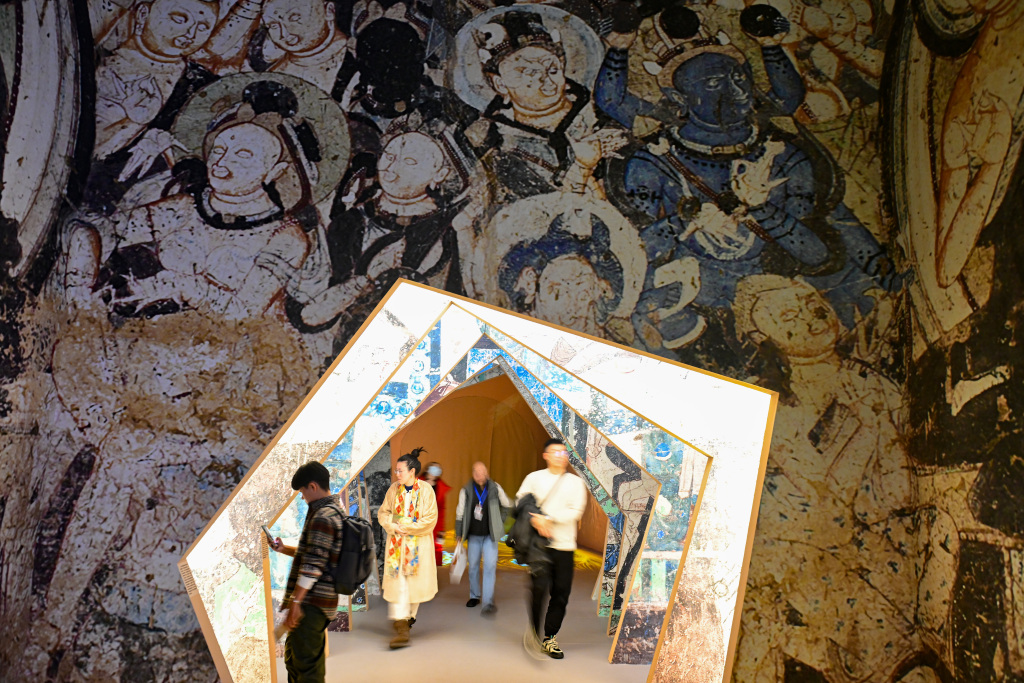 An immersive exhibition featuring Chinese grotto art opens to the public at the National Museum of China in Beijing on December 9, 2023. /CFP