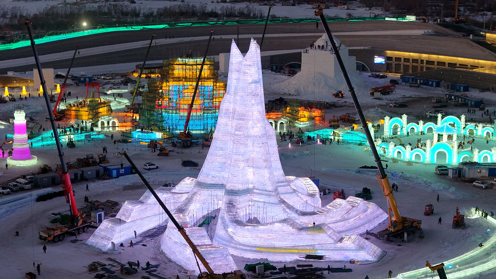 Gigantic ice sculptures are seen under construction at the Harbin Ice and Snow World in northeast China's Heilongjiang Province, December 9, 2023. / CFP