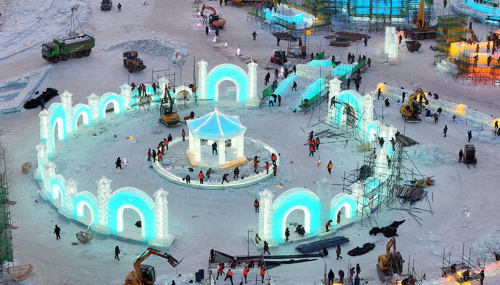 Gigantic ice sculptures are seen under construction at the Harbin Ice and Snow World in northeast China's Heilongjiang Province, December 9, 2023. / CFP