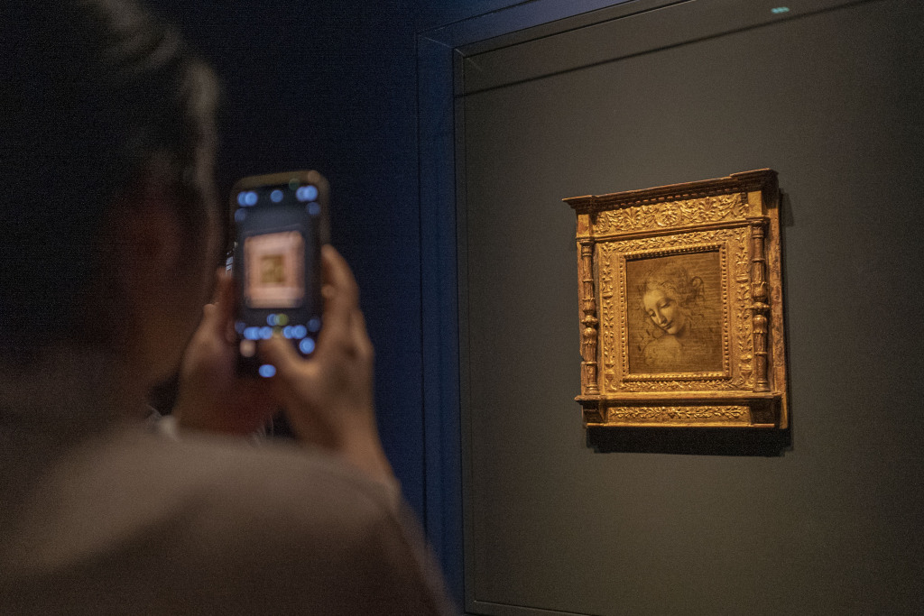 A visitor takes a photo of 