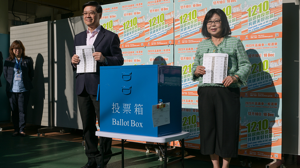 Chief Executive of the Hong Kong Special Administrative Region (HKSAR), John Lee Ka-chiu, and his wife Janet Lam Lai-sim, cast their votes in the District Council election, in the HKSAR, China, December 10, 2023. /CFP