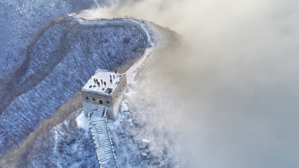 A photo shows visitors on the Jiankou section of the Great Wall in Beijing on December 11, 2023. /IC