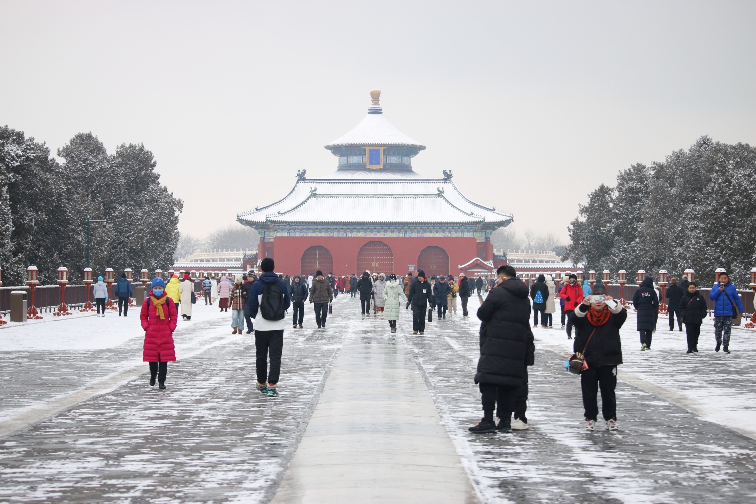 People visit the snow-capped Temple of Heaven in Beijing on Dec. 11, 2023. /CGTN