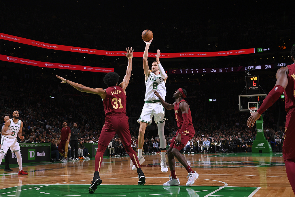 Kristaps Porzingis (#8) of the Boston Celtics shoots in the game against the Cleveland Cavaliers at TD Garden in Boston, Massachusetts, December 12, 2023. /CFP
