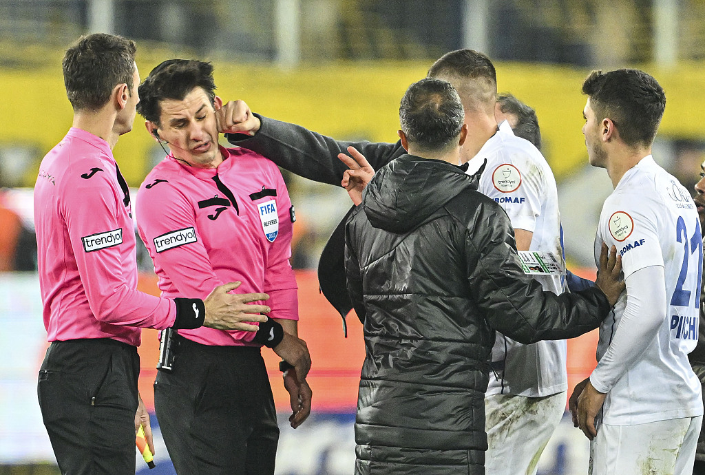 Referee Halil Umut Meler (L2) receives a punch to the face from Faruk Koca, president of Ankaragucu, after the end of the Turkish Super Lig game against Rizespor at Eryaman Stadium in Ankara, Türkiye, December 11, 2023. /CFP