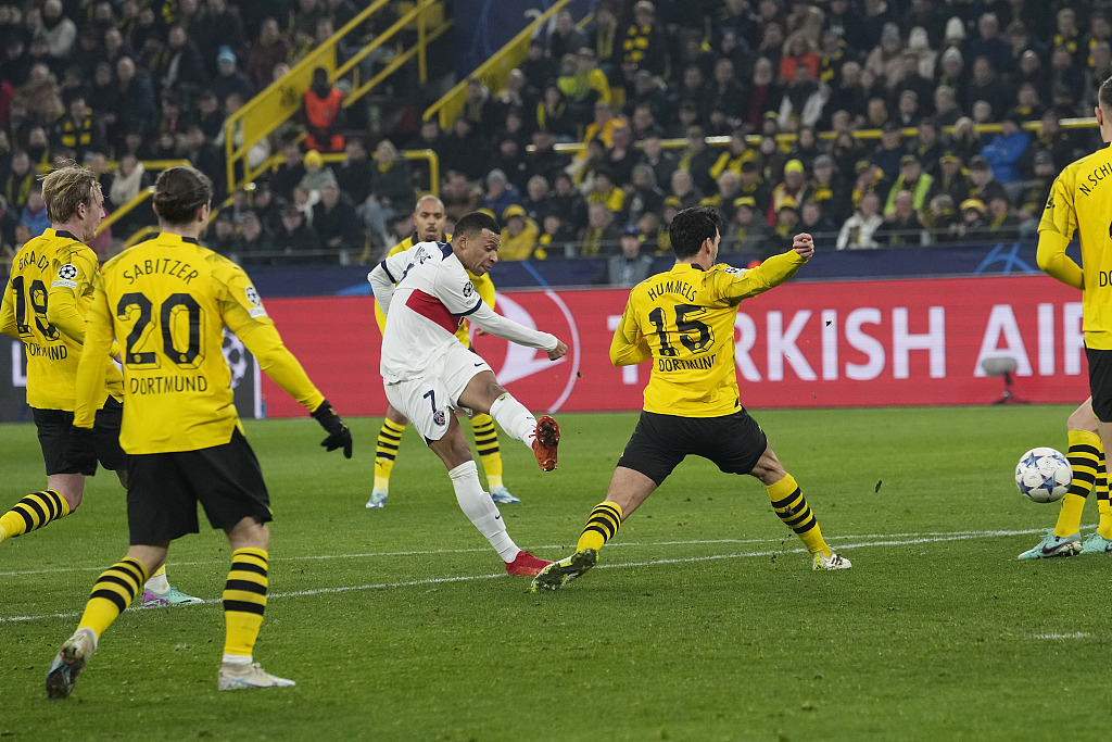 Kylian Mbappe (#7) of Paris Saint-Germain shoots in the UEFA Champions League group game against Borussia Dortmund at the Signal Iduna Park in Dortmund, Germany, December 13, 2023. /CFP