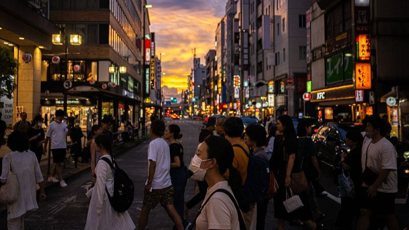 People stroll down a shopping street in Tokyo's Kichijoji area in Japan, August 27, 2023. /CFP