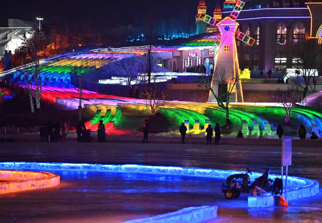 A photo shows the bottom end of the multi-lane, ultra-long ice slide at this year's Changchun Ice and Snow New World in Changchun, Jilin Province on December 12, 2023. /IC