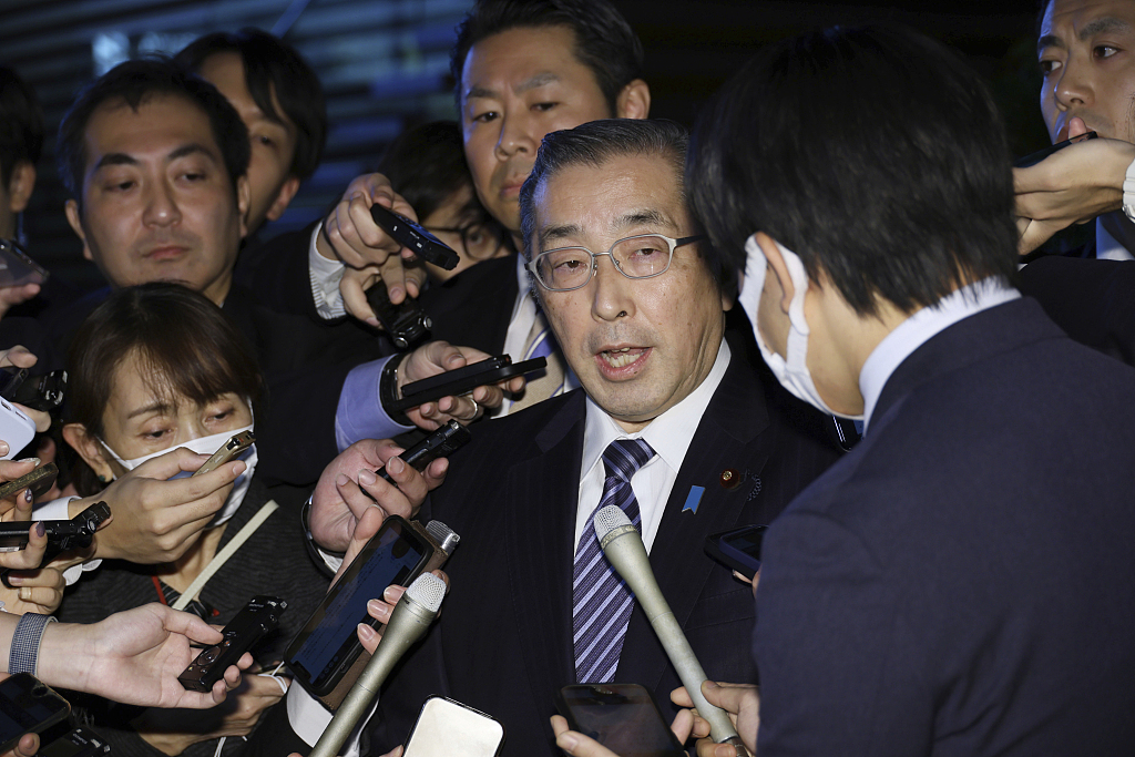 Japanese Minister of Internal Affairs and Communications Junji Suzuki answers questions from reporters after submitting his resignation at the Prime Minister's Office in Tokyo, Japan, December 14, 2023. /CFP