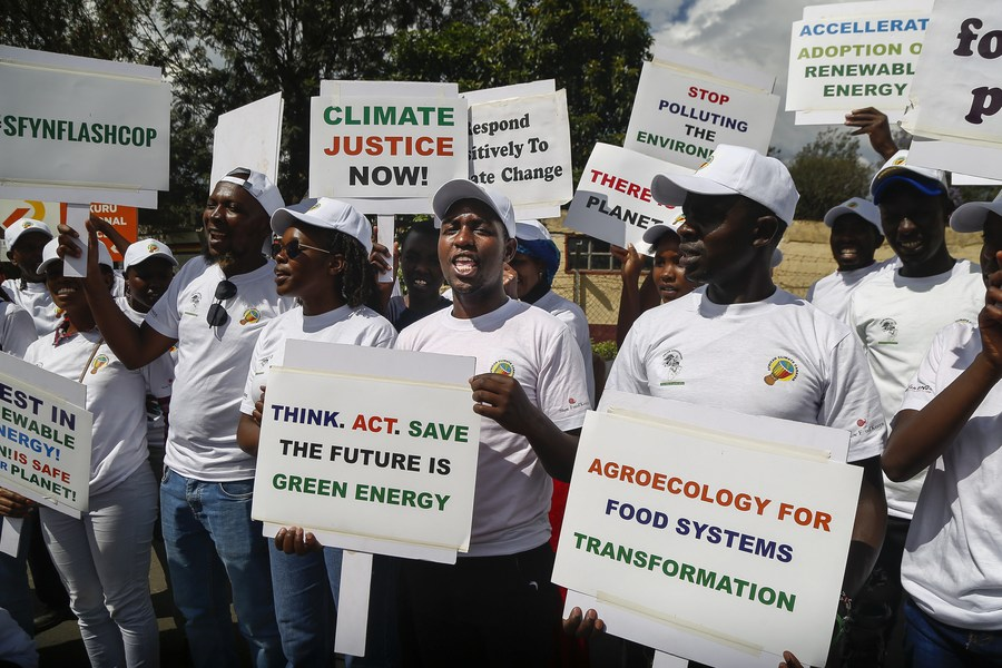 Climate activists display placards during a demonstration in Nakuru county, Kenya, November 14, 2023. /Xinhua