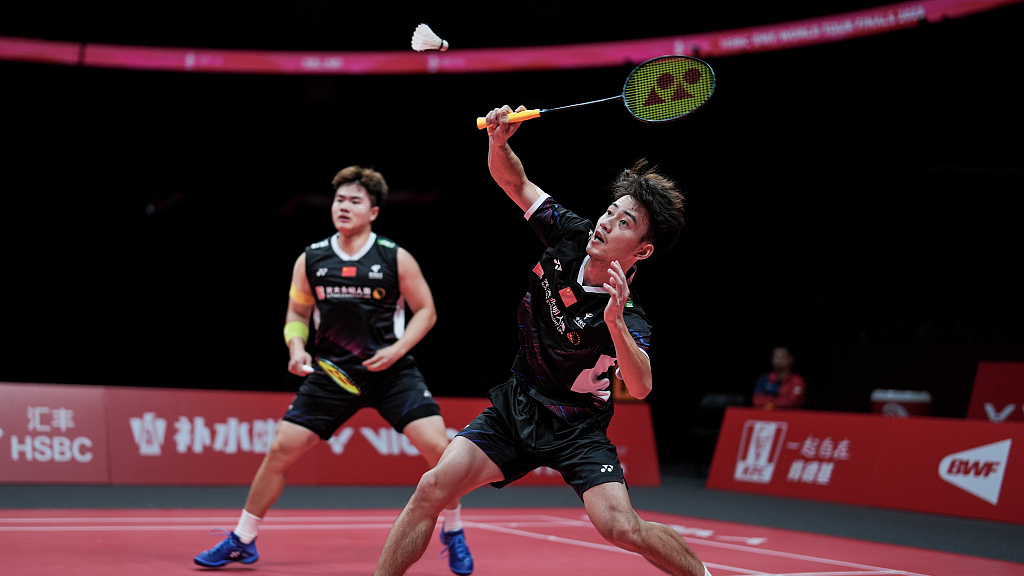 Wang Chang (R) and Liang Weikeng in action during the men's doubles round-robin match at the BWF World Tour Finals in Hangzhou, China, December 15, 2023. /CFP