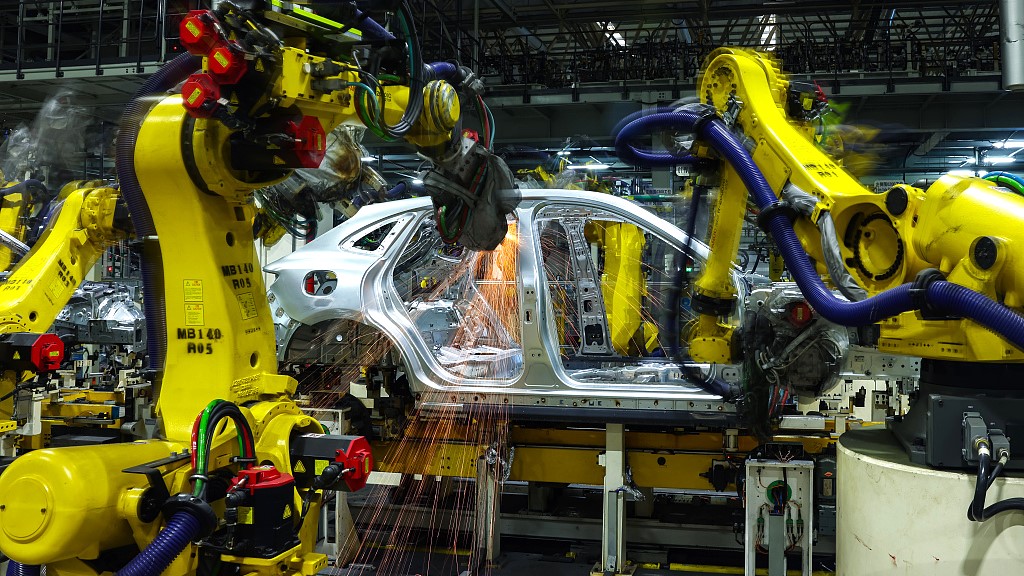 Robot arms operate on a car plant in southwest China's Chongqing municipality, November 15, 2023. /CFP