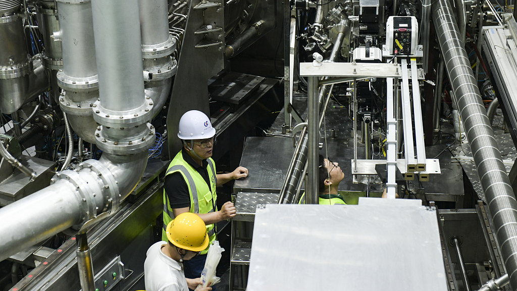 Scientists debug equipment on the Experiment Advanced Superconducting Tokamak, China's 