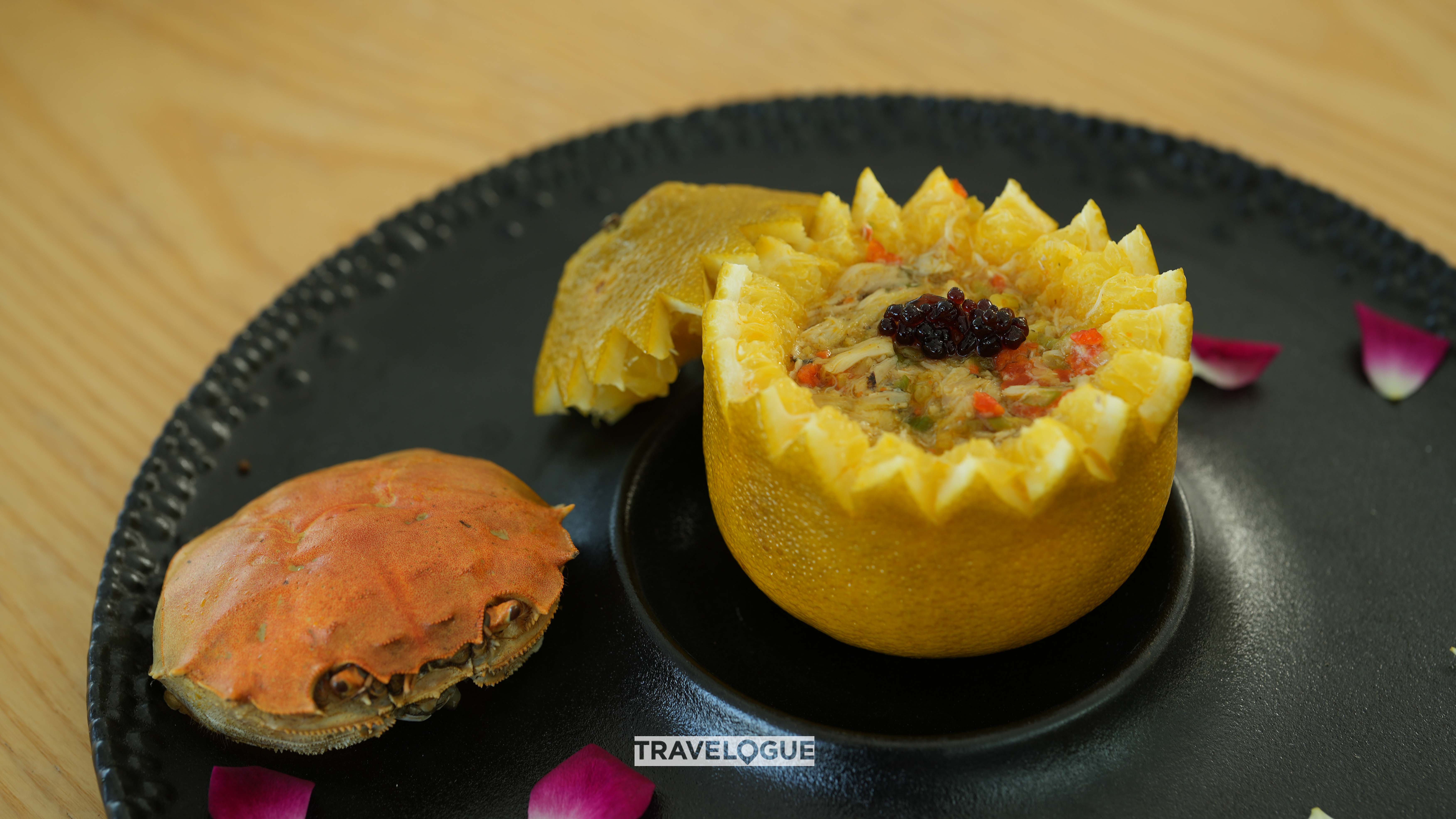 Diced crab cooked inside an orange, a dish that dates back to the Song Dynasty some 1,000 years ago. /CGTN