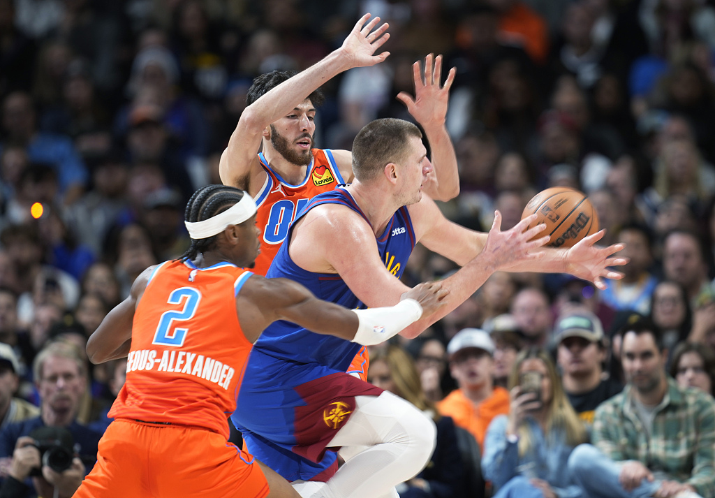 Nikola Jokic (C) of the Denver Nuggets is double-teamed by defenders of the Oklahoma City Thunder in the game at Ball Arena in Denver, Colorado, December 16, 2023. /CFP