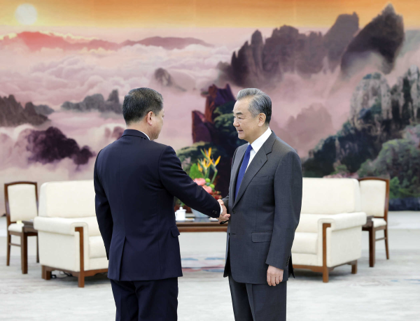 Chinese Foreign Minister Wang Yi (R) shakes hands with Deputy Foreign Minister of the Democratic People's Republic of Korea Pak Myong Ho in Beijing, China, December 18, 2023. /Chinese Foreign Ministry