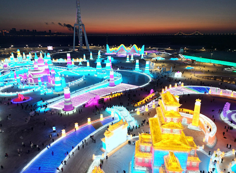 A series of ice and snow sculptures and artistic installations are illuminated at Harbin Ice and Snow World during trial operations in Harbin City, Heilongjiang Province, on December 17, 2023. /CFP