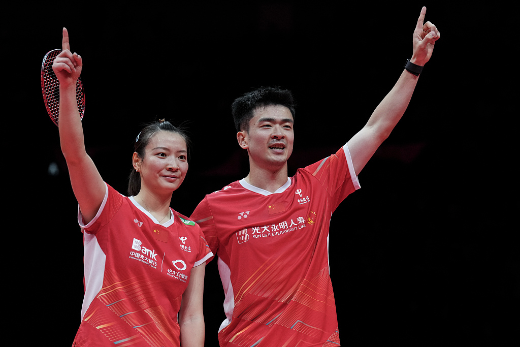 China's Zheng Siwei (R) and Huang Yaqiong react after the mixed doubles final of the BWF World Tour Finals in Hangzhou, China, December 17, 2023. /CFP