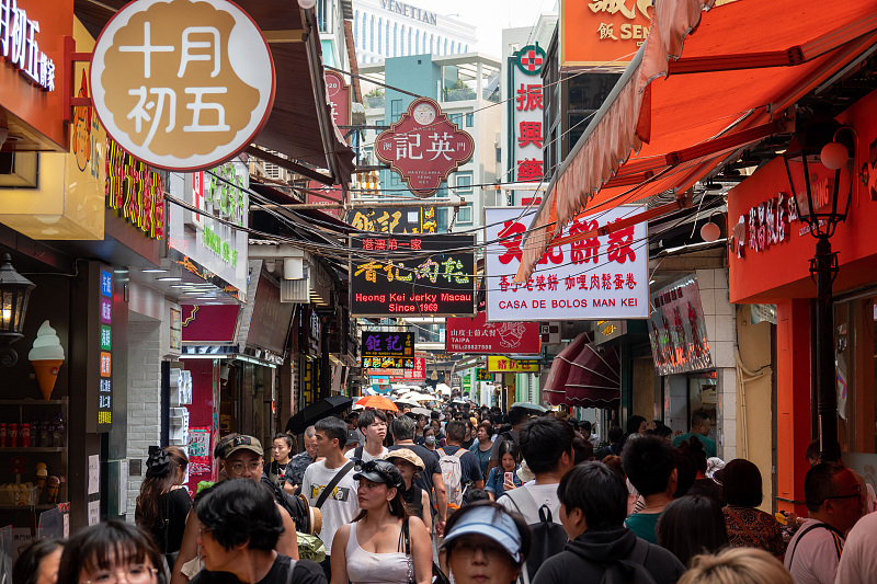 Many visitors enjoy leisure time on the Rua do Cunha street in Macao, July 26, 2023. /CFP