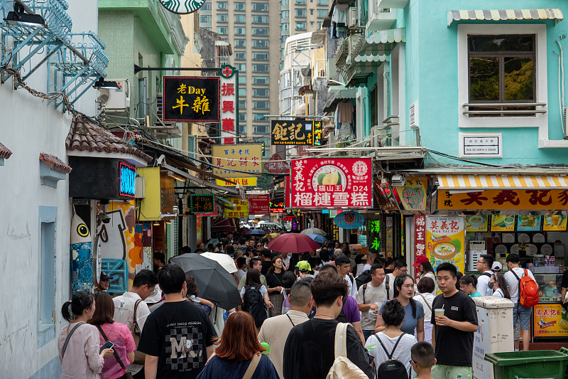 Many visitors enjoy leisure time on the Rua do Cunha street in Macao, July 26, 2023. /CFP