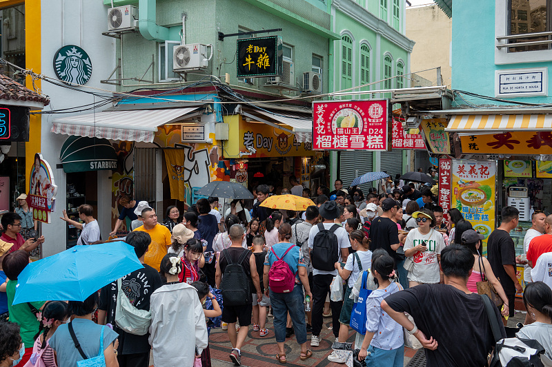 Many visitors enjoy leisure time on the Rua do Cunha street in Macao, July 26, 2023. /CFP