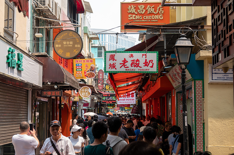Many visitors enjoy leisure time on the Rua do Cunha street in Macao, July 26, 2023. /CFP