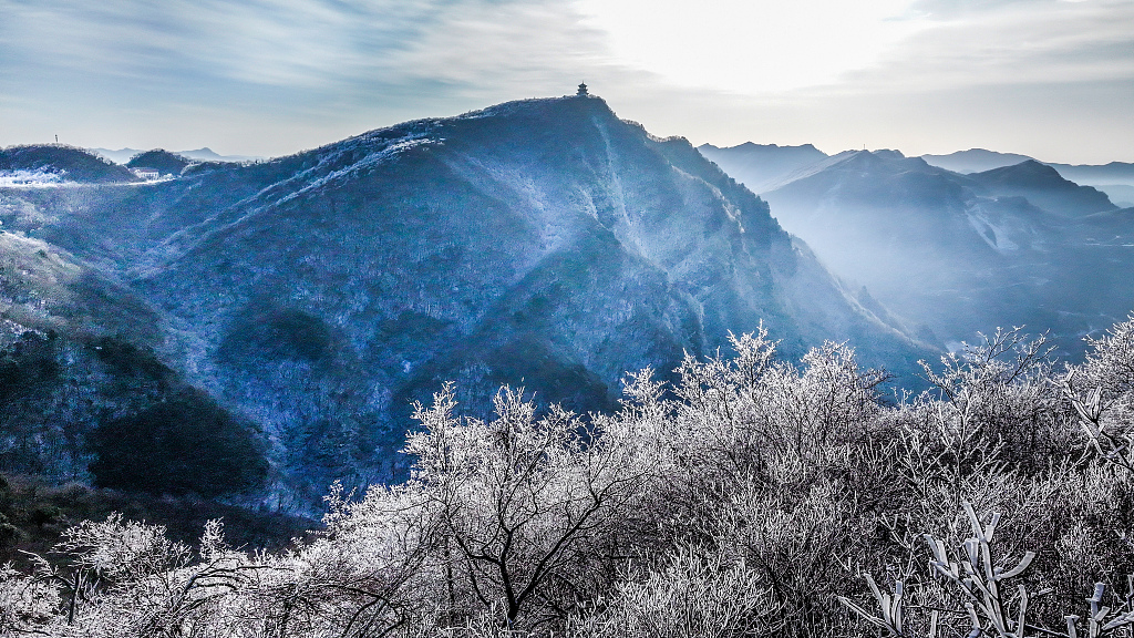 A photo shows a view of the snow-covered Longtou Mountain Scenic Area in Hanzhong, Shaanxi Province, on December 19, 2023. /CFP