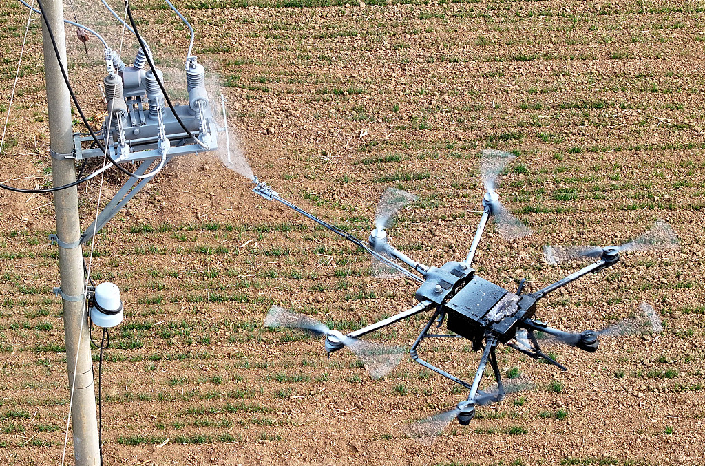 A drone is operated by workers in Bozhou City of east China's Anhui Province, November 22, 2023. /CFP