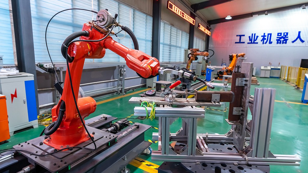 An industrial robot undergoing comprehensive debugging before delivery in a local manufacturing enterprise in Yuncheng City, north China's Shanxi Province, December 18, 2023. /CFP