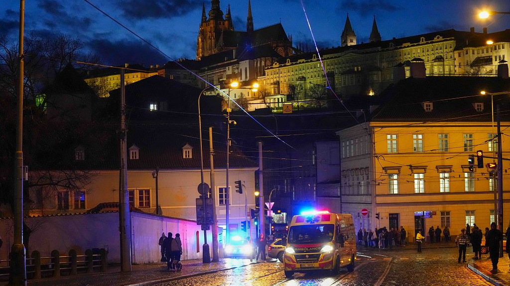 An ambulance drives toward Charles University in downtown Prague, the Czech Republic, December 21, 2023. /CFP