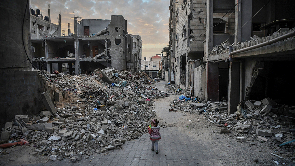 A child walks among rubbles of the destroyed buildings due to ongoing Israeli attacks on in Rafah, Gaza, December 21, 2023. /CFP