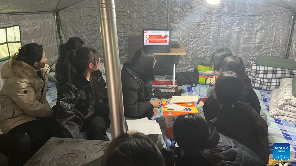 High school students take online lectures at a temporary relocation site in Jishishan County, northwest China's Gansu Province, December 22, 2023. /Xinhua