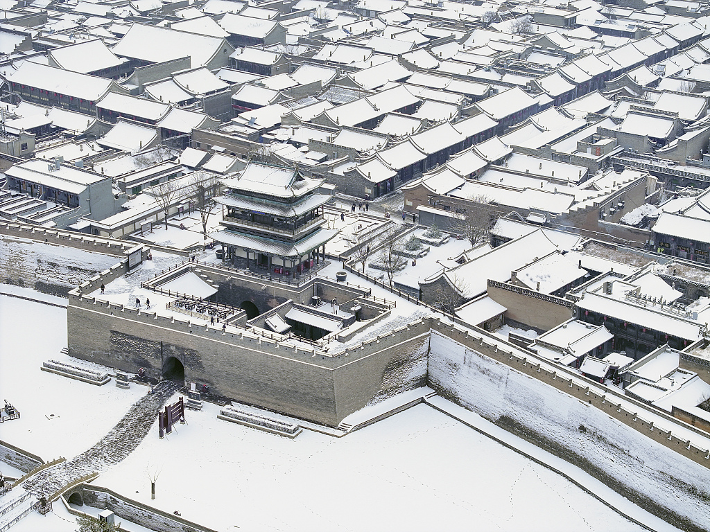 A photo taken on December 11, 2023, shows the snowy scenery of Pingyao Ancient City in Shanxi Province. /CFP
