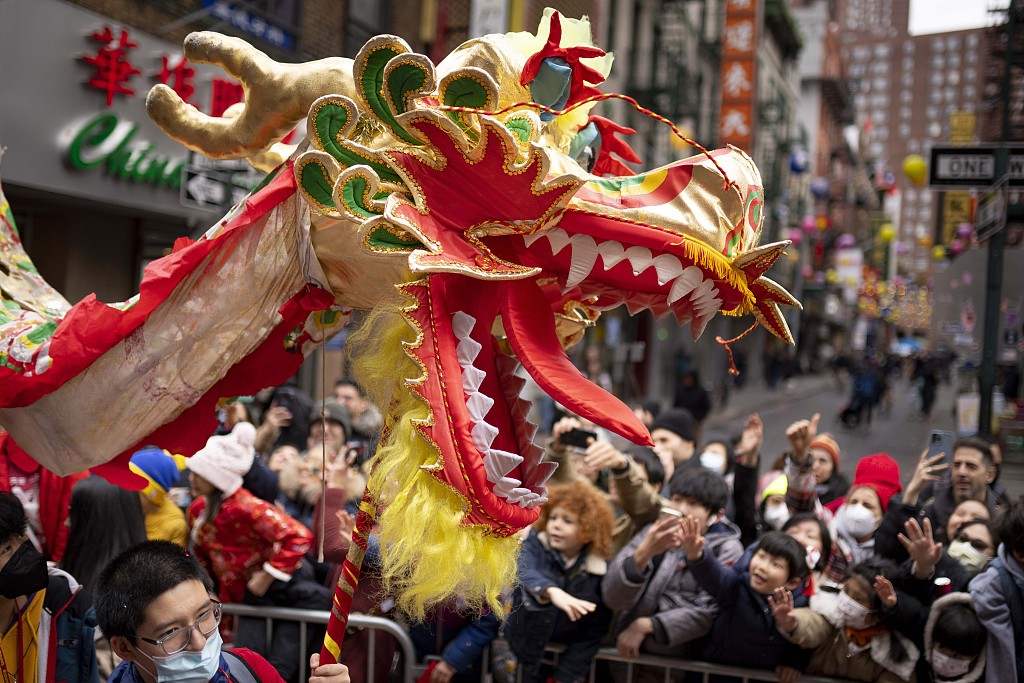 People celebrate the Spring Festival with dragon dancing in Manhattan's Chinatown on February 12, 2023. /CFP