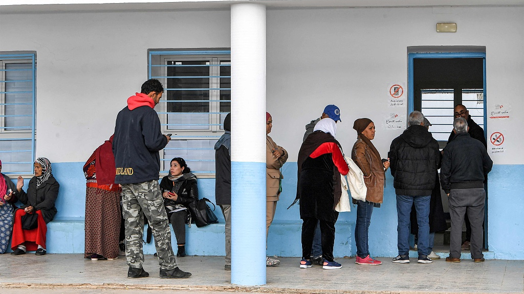 Voters queue outside a polling station during the 2023 local elections in the locality of Mnihla in Ariana province on the outskirts of Tunis, December 24, 2023. /CFP