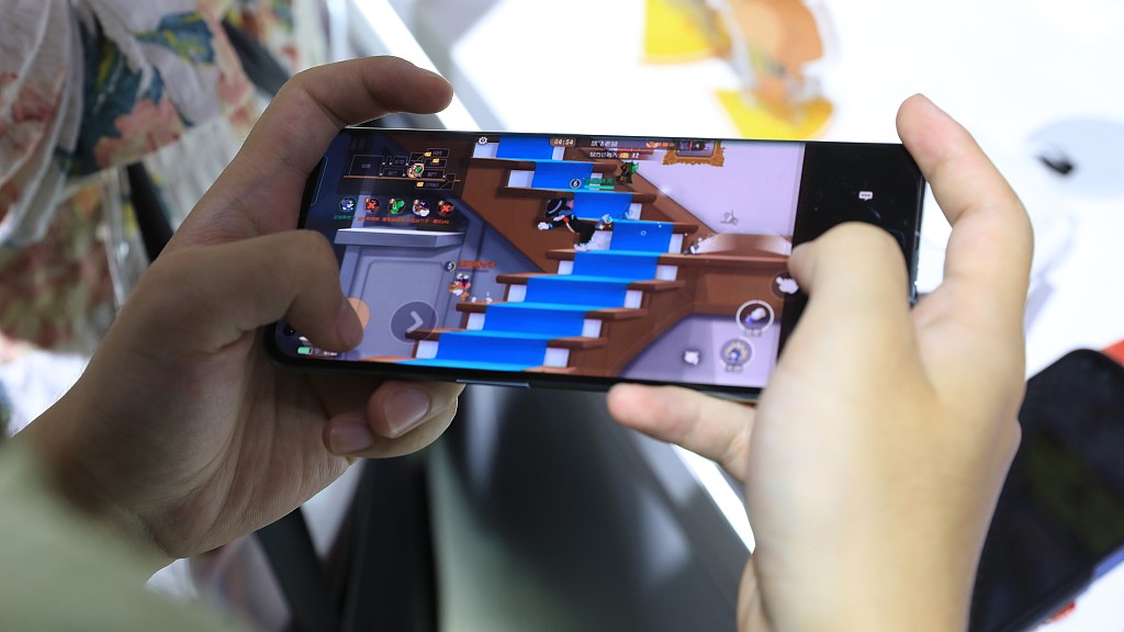 A user playing a mobile game during ChinaJoy in Shanghai, July 28, 2023. /CFP