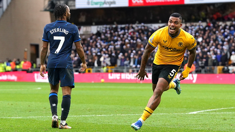 Wolves' Mario Lemina (R) celebrates scoring their side's first goal as Chelsea's Raheem Sterling looks on during their Premier League match at Molineux Stadium, England, December 24, 2023. /CFP