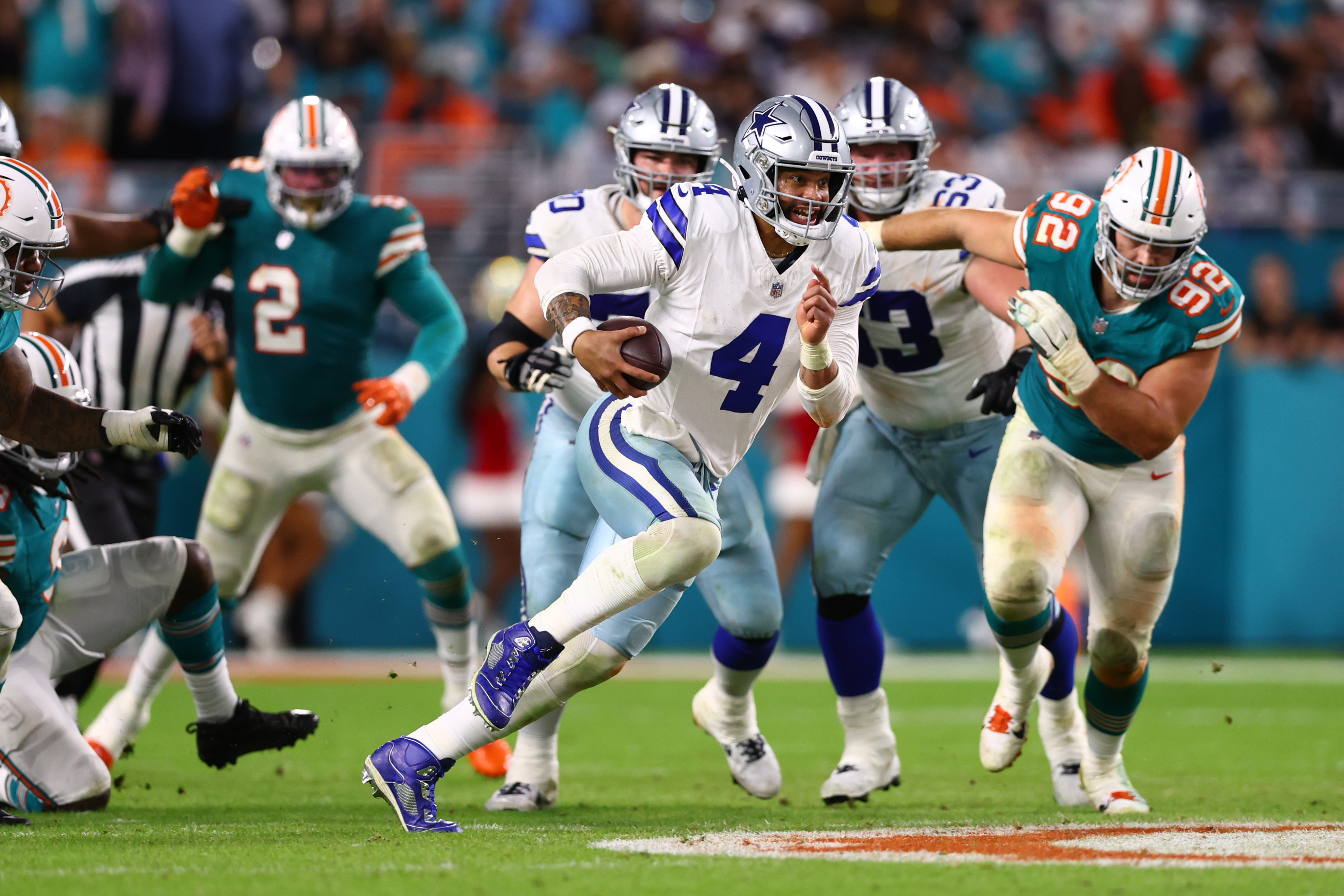 Quarterback Dak Prescott (#4) of the Dallas Cowboys runs with the ball in the game against the Miami Dolphins at Hard Rock Stadium in Miami Gardens, Florida, December 24, 2023. /CFP