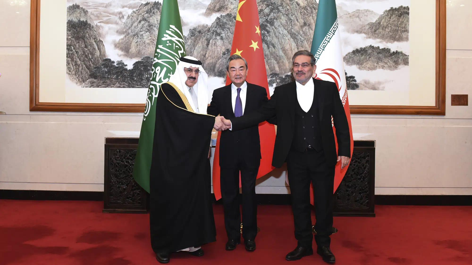 Admiral Ali Shamkhani (R), secretary of the Supreme National Security Council of Iran, shakes hands with Musaad bin Mohammed Al-Aiban (L), Saudi Arabia's Minister of State, as Wang Yi (C), then director of the Office of the Foreign Affairs Commission of the Communist Party of China Central Committee, looks on for a photo during a meeting in Beijing, China, March 10, 2023. /Xinhua