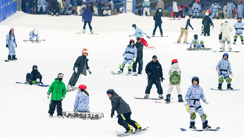 People have fun at a ski resort in Huzhou, east China's Zhejiang Province, December 25, 2023. /CFP