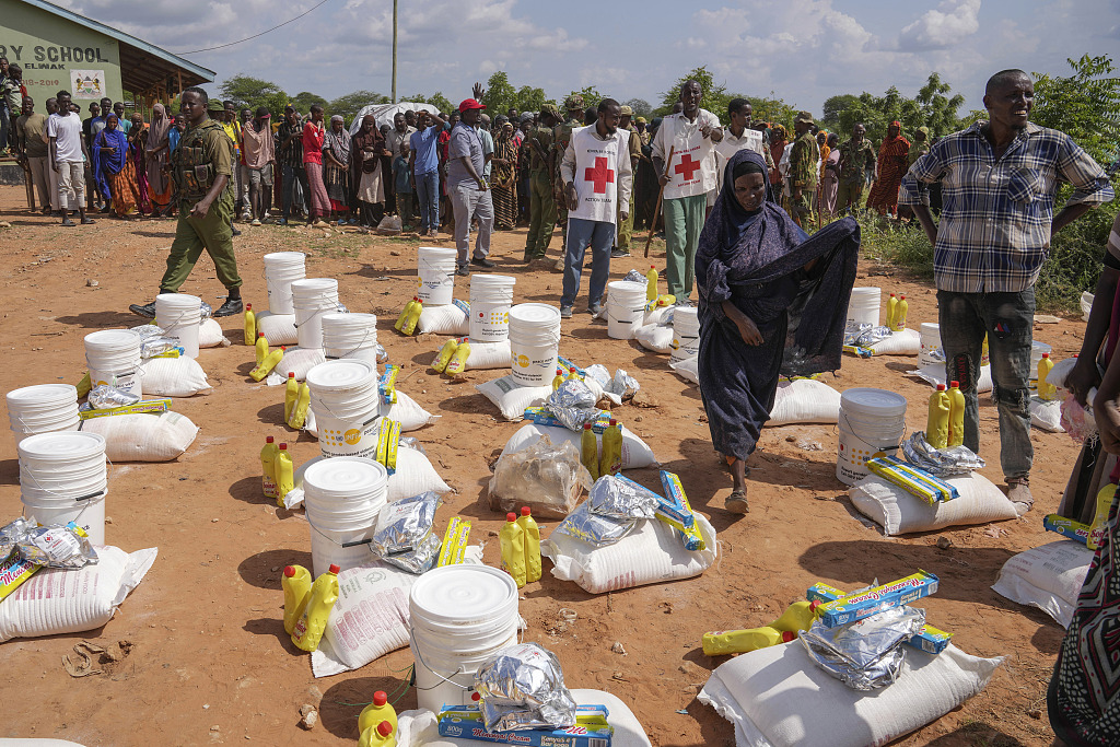 Residents gather for a planned distribution of food after El Nino rains damaged their houses, in Mandera County, Kenya, December 13, 2023. /CFP