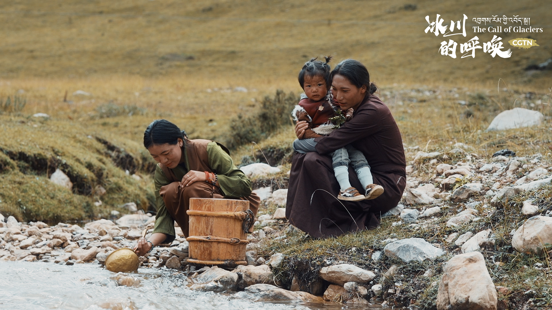 Local women get water along a river in Yushu Tibetan Autonomous Prefecture, northwest China's Qinghai Province. 