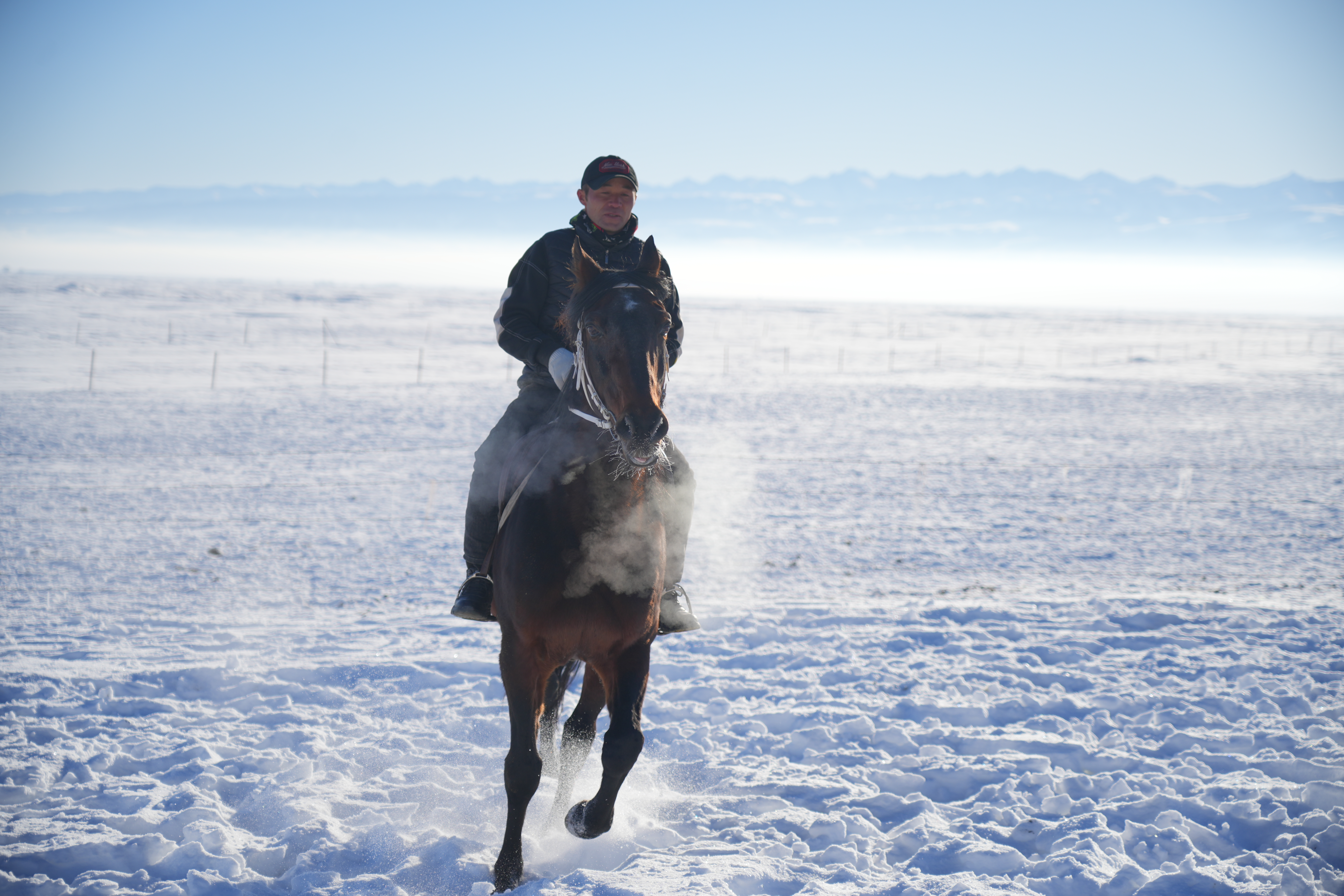 A man rides a horse at a horse field in Zhaosu County, Kazak Autonomous Prefecture of Ili, northwest China's Xinjiang Uygur Autonomous Region, December 23, 2023. /CGTN