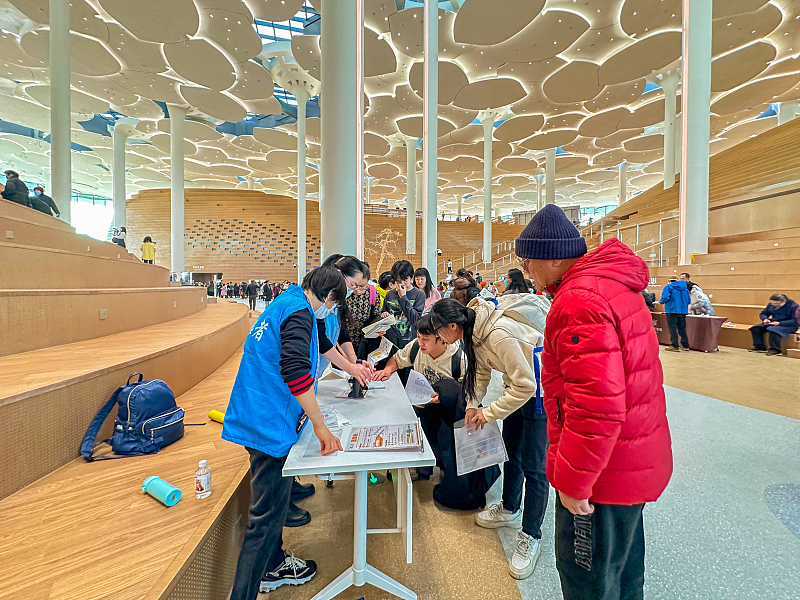 Visitors take part in cultural activities at the Beijing City Library, on December 27, 2023. /CFP