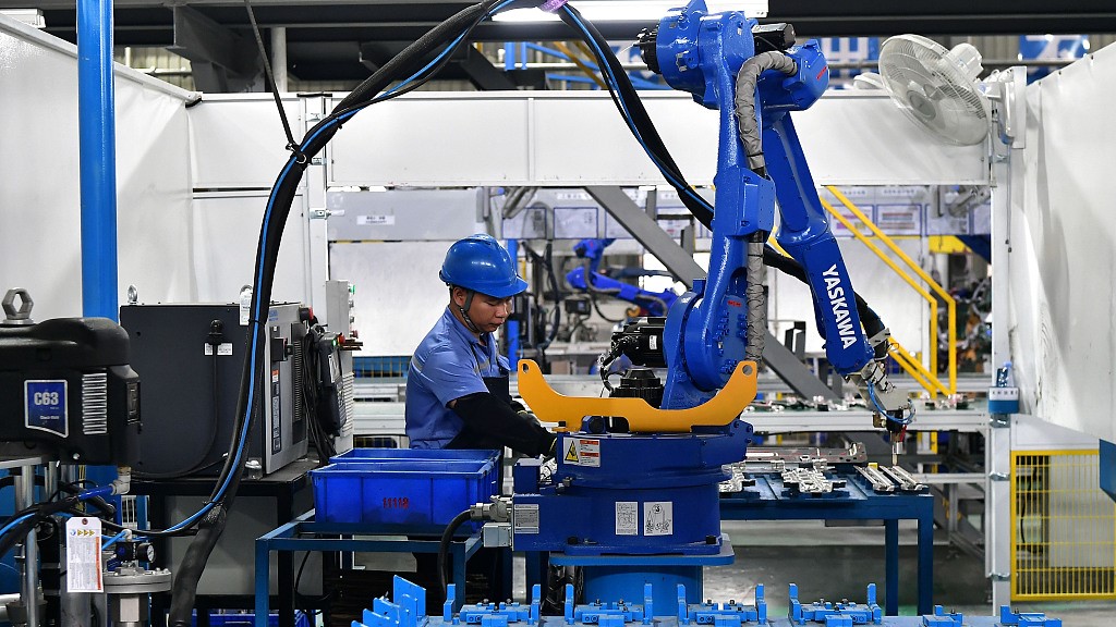 A worker assembles car parts in southeastern China's Fujian Province, June 15, 2023. /CFP